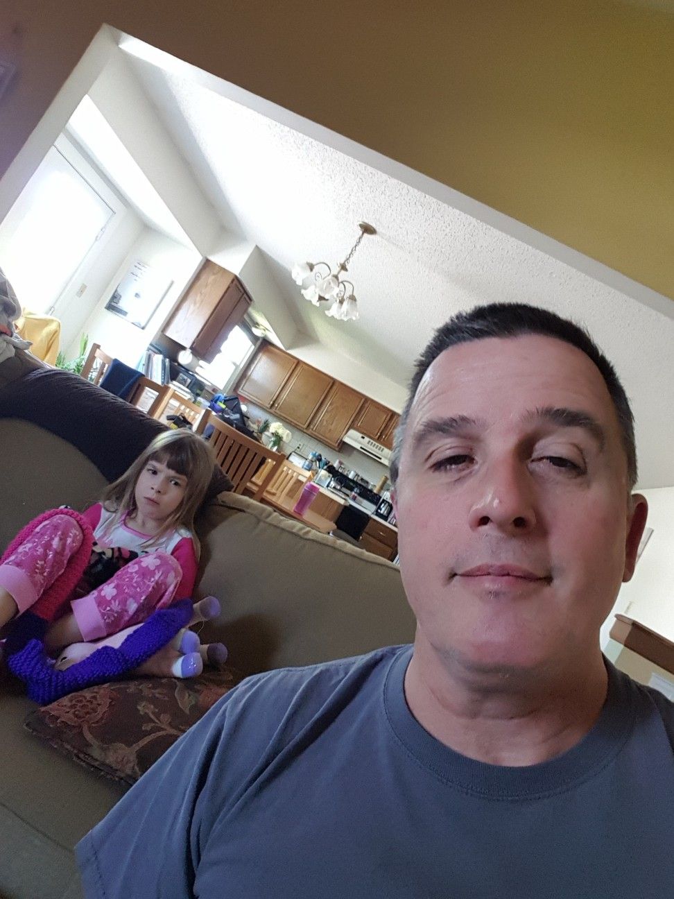 Colene Martin at home with his daughter in the living room