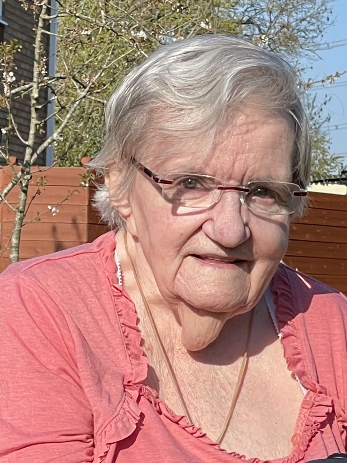 Portrait of Elena Rossi smiling in her garden